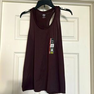 Size medium (8-10) racer back tank top. Moisture wicking materiall